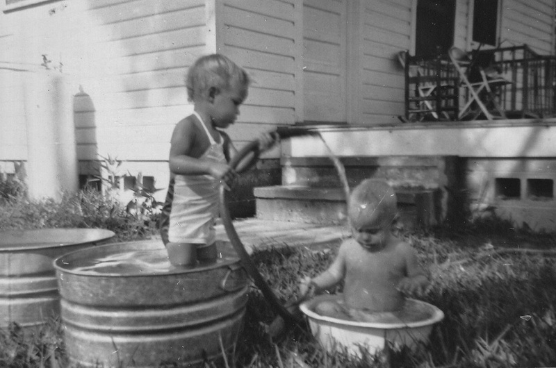 Brenda giving Larry a bath