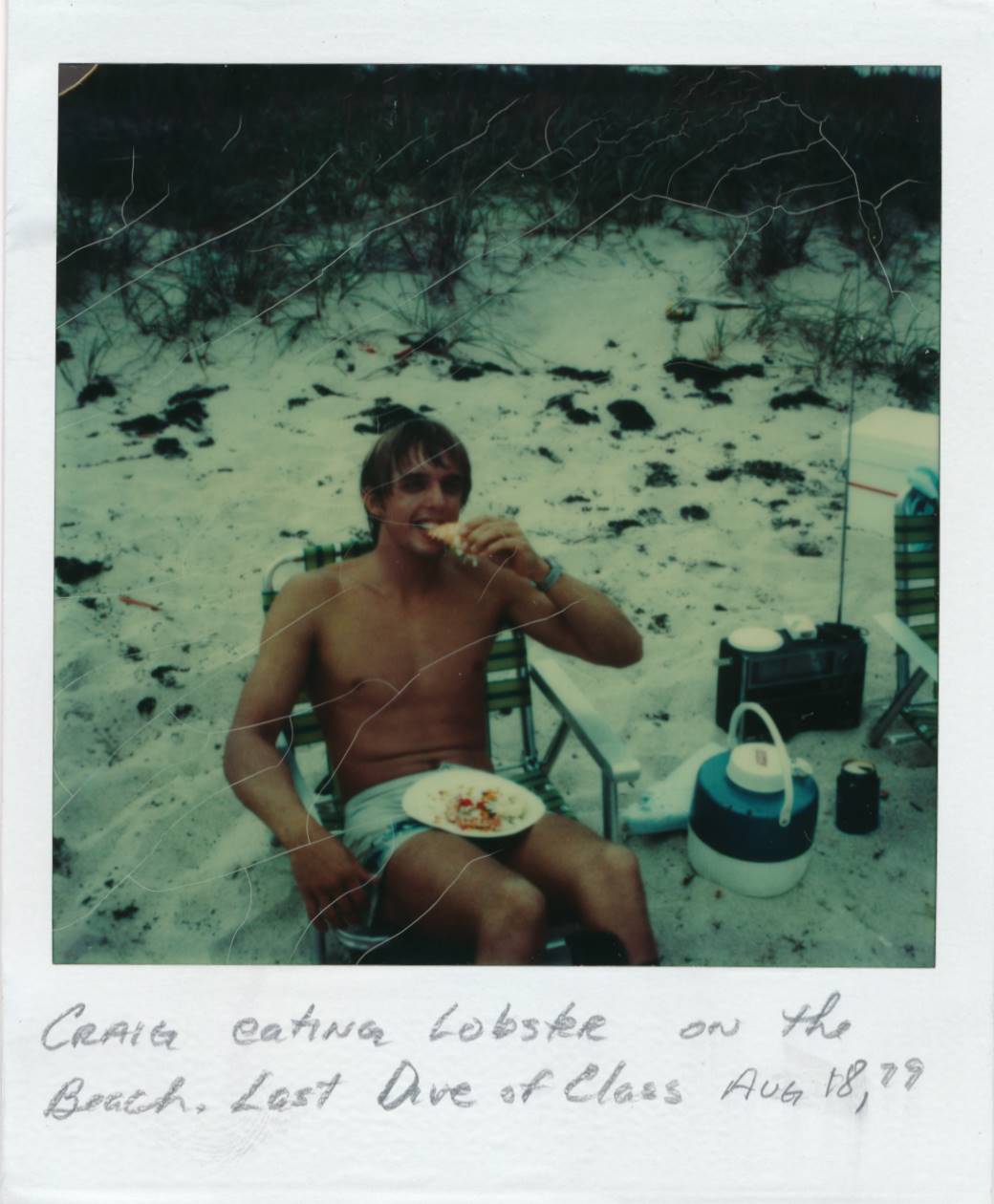 Craig eating Lobster on beach