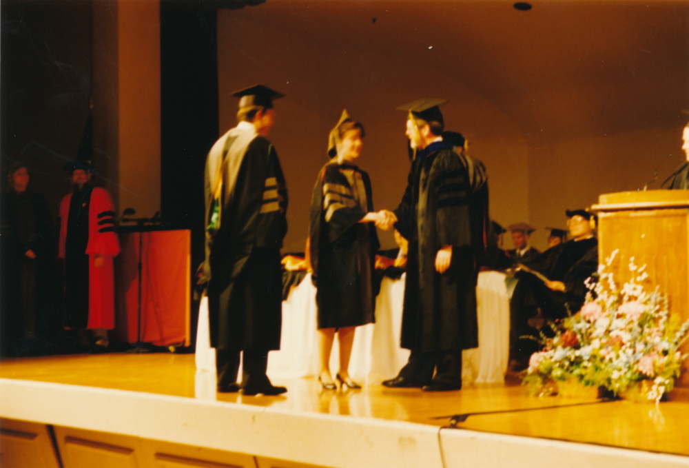 An receiving her diploma
